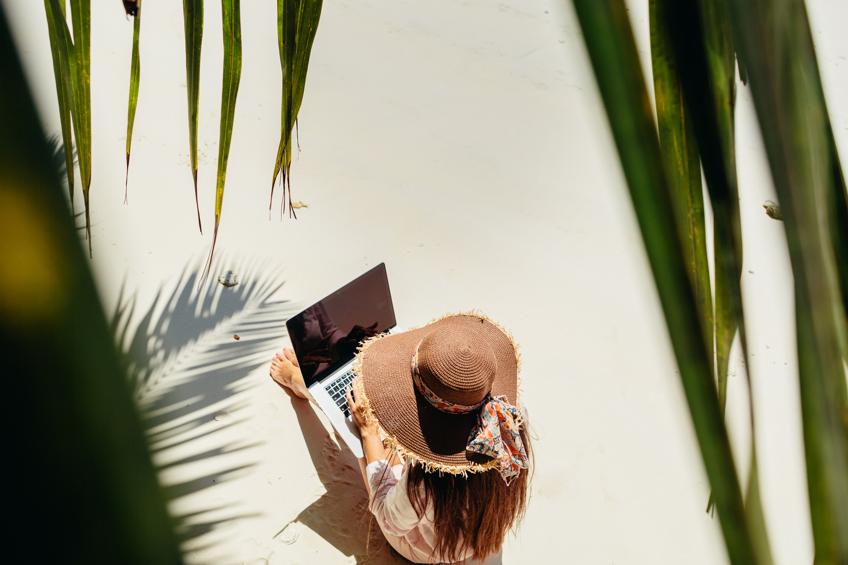 Woman Working Remotely at the Beach 
